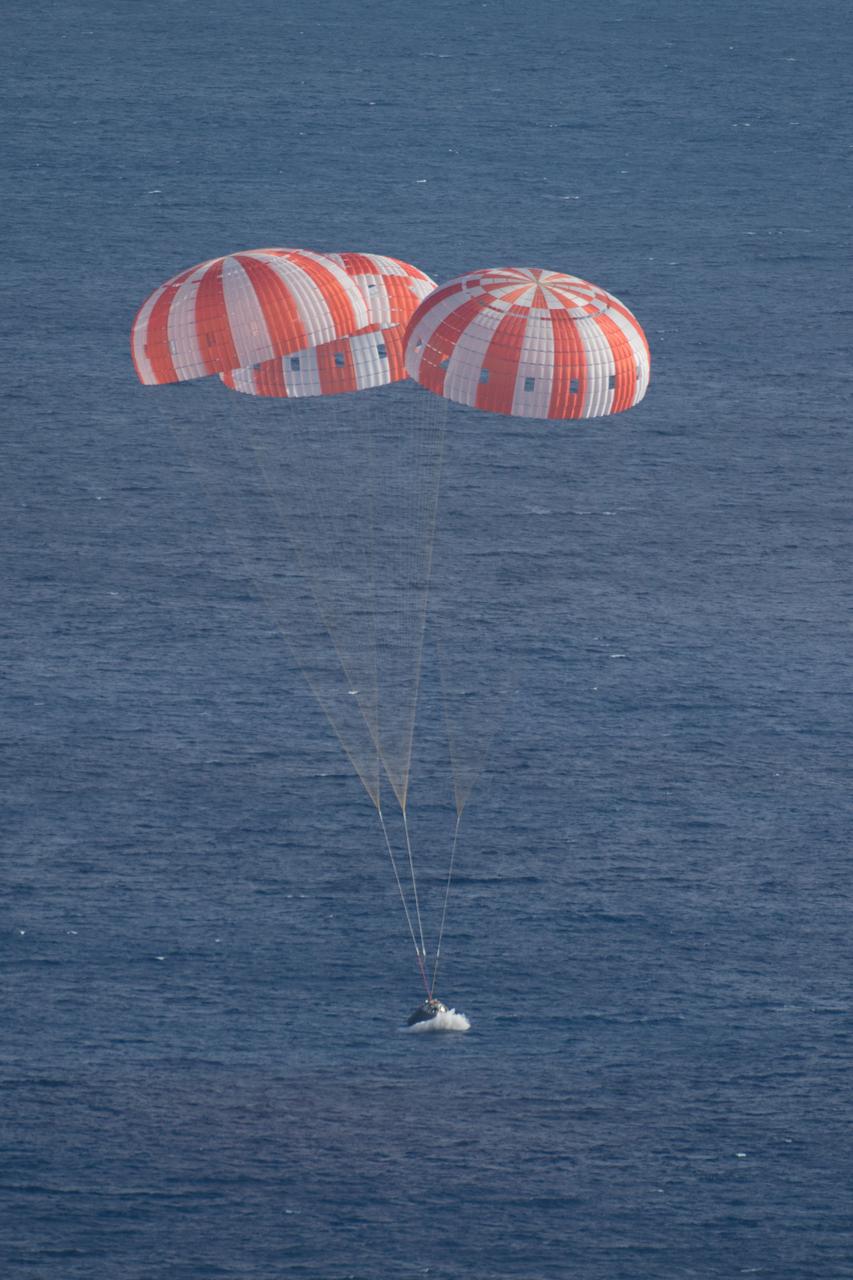 Orion's parachutes deploy as it returns to Earth after Exploration Flight Test-1 (EFT-1) on Dec. 5, 2014.  Part of Batch image transfer from Flickr.