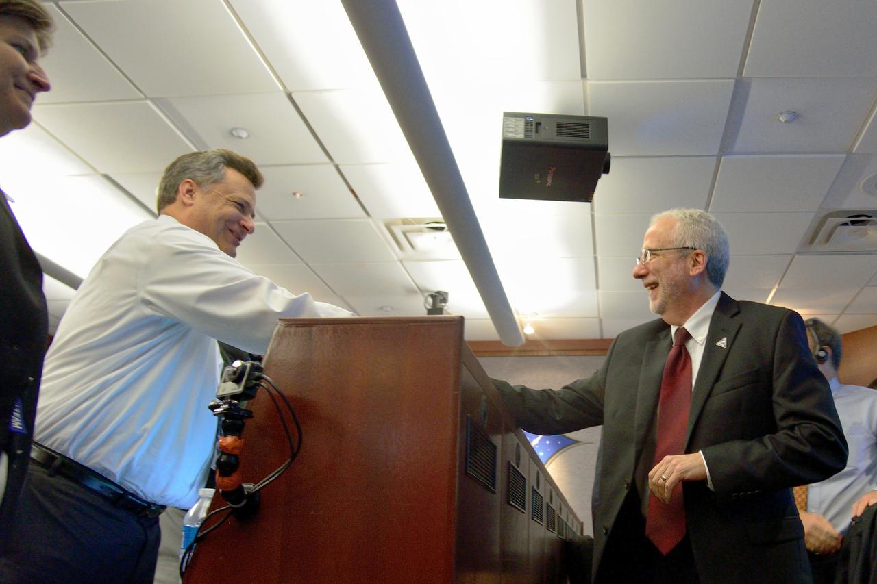 Orion Program Manager Mark Geyer congratulates the team after Orion's successful Exploration Flight Test-1 (EFT-1) mission in Building AE at Cape Canaveral Air Force Station on Dec. 5, 2014. The Orion spacecraft orbited Earth twice, reaching an altitude of approximately 3,600 miles above Earth before landing. No one was aboard Orion for this flight test, but the spacecraft is designed to allow us to journey to destinations never before visited by humans, including an asteroid and Mars. Part of Batch image transfer from Flickr.