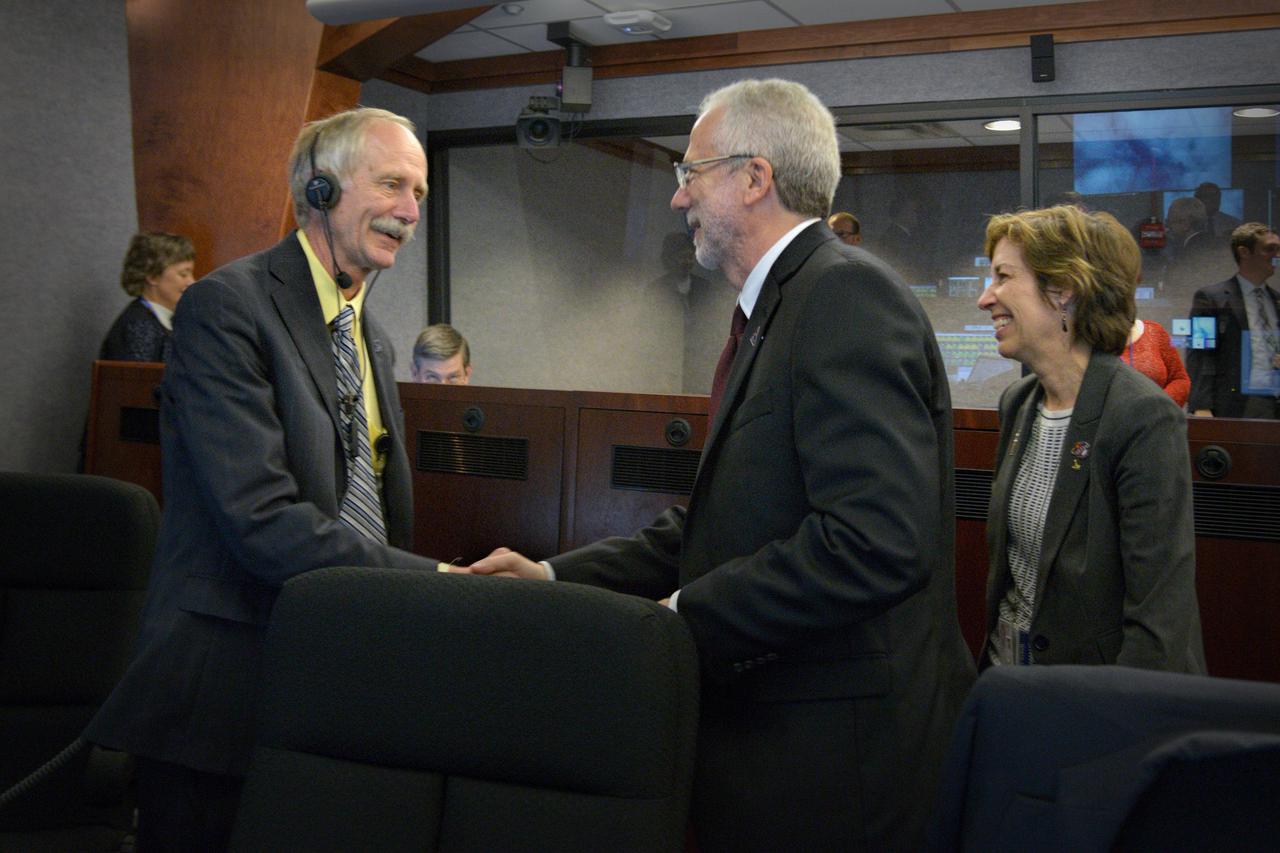 The Orion team celebrates Orion's successful Exploration Flight Test-1 (EFT-1) mission in Building AE at Cape Canaveral Air Force Station on Dec. 5, 2014. Orion Program Manager Mark Geyer, NASA Director Ellen Ochoa and NASA Associate Administrator for the Human Exploration and Operations Directorate William Gerstenmaier are in frame. The Orion spacecraft orbited Earth twice, reaching an altitude of approximately 3,600 miles above Earth before landing. No one was aboard Orion for this flight test, but the spacecraft is designed to allow us to journey to destinations never before visited by humans, including an asteroid and Mars. Part of Batch image transfer from Flickr.