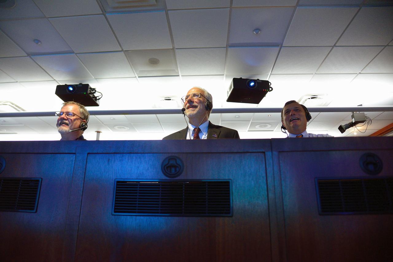 Lockheed Martin Program Manager Mike Hawes, Orion Program Manager Mark Geyer, and Orion Deputy Program Manager Mike Kirasich watch Orion's Exploration Flight Test-1 (EFT-1) reentry sequence in Building AE at Cape Canaveral Air Force Station on a live stream from the Ikhana aircraft on Dec. 5, 2014. The Orion spacecraft orbited Earth twice, reaching an altitude of approximately 3,600 miles above Earth before landing. No one was aboard Orion for this flight test, but the spacecraft is designed to allow us to journey to destinations never before visited by humans, including an asteroid and Mars. Part of Batch image transfer from Flickr.