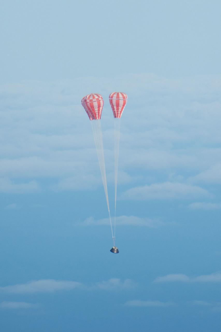 Orion's parachutes deploy as it returns to Earth after Exploration Flight Test-1 (EFT-1) on Dec. 5, 2014.  Part of Batch image transfer from Flickr.