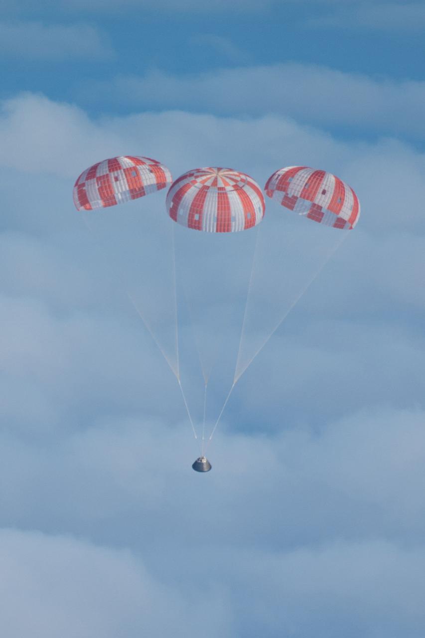 Orion's parachutes deploy as it returns to Earth after Exploration Flight Test-1 (EFT-1) on Dec. 5, 2014.   Part of Batch image transfer from Flickr.