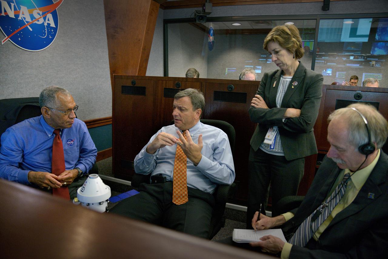 The Orion team (including JSC Director Ellen Ochoa, NASA Administrator Charles Bolden  and  Operations Directorate William Gerstenmaier) discuss Orion operations in Building AE at Cape Canaveral Air Force Station during Exploration Flight Test-1 (EFT-1) on Dec. 5, 2014. Part of Batch image transfer from Flickr.