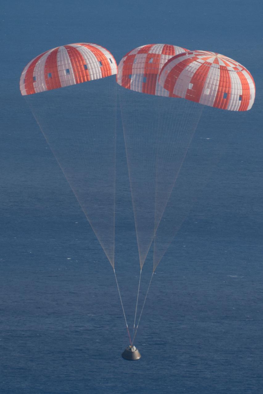 Orion's parachutes deploy as it returns to Earth after Exploration Flight Test-1 (EFT-1) on Dec. 5, 2014.  Part of Batch image transfer from Flickr.