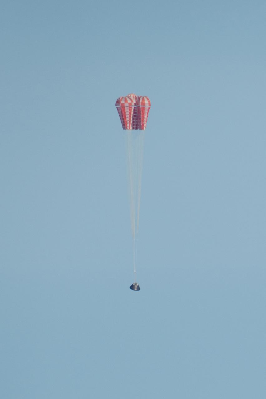 Orion's main parachutes begin to unfurl as it returns to Earth during Exploration Flight Test-1 (EFT-1) on Dec. 5, 2014.  Part of Batch image transfer from Flickr.