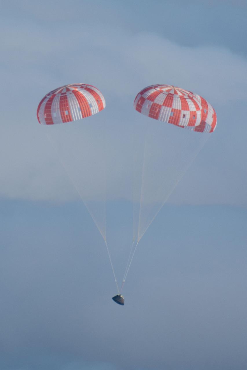 Orion's parachutes deploy as it returns to Earth after Exploration Flight Test-1 (EFT-1) on Dec. 5, 2014.  Part of Batch image transfer from Flickr.