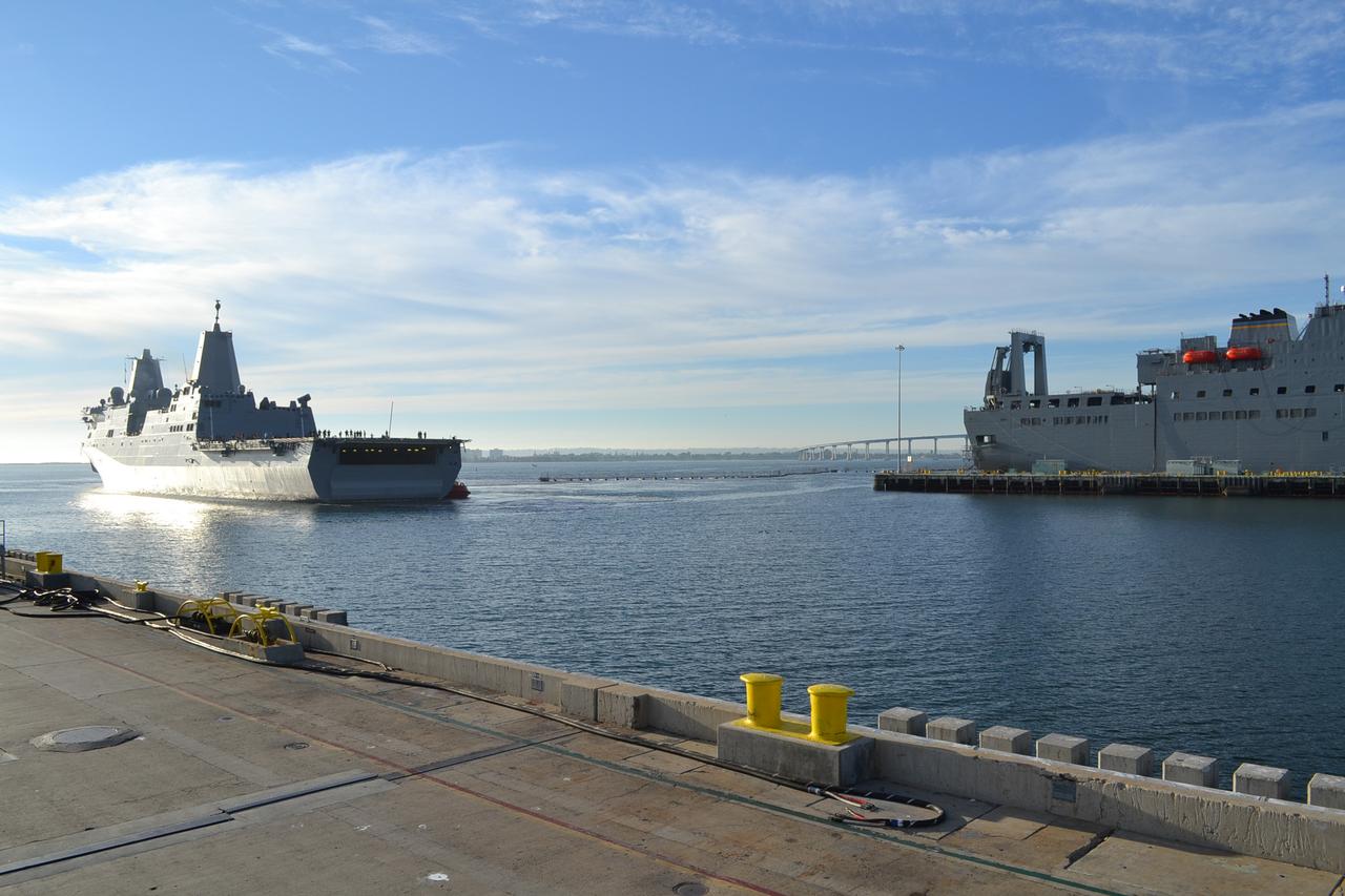The USS Anchorage, carrying the Orion crew module, arrives in San Diego on Dec. 8, 2014. The Orion spacecraft successfully completed the first flight last week, traveling to an altitude of 3600 miles and returning to Earth at 20,000 miles per hour. The Navy and NASA team on board the USS Anchorage recovered Orion in the Pacific Ocean after splashdown.  Part of Batch image transfer from Flickr.