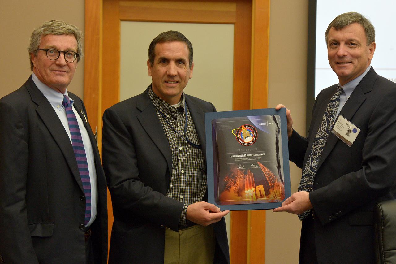 The Orion leadership team visits Janicki Industries in Sedro-Woolley, Washington on March 9, 2015 to thank them for their work in support of Exploration Flight Test-1 (EFT-1). Award presented to Janicki Industries Orion Program Team. Janicki is a small business that specializes in producing custom tooling fixtures and composite structures.  Part of Batch image transfer from Flickr.