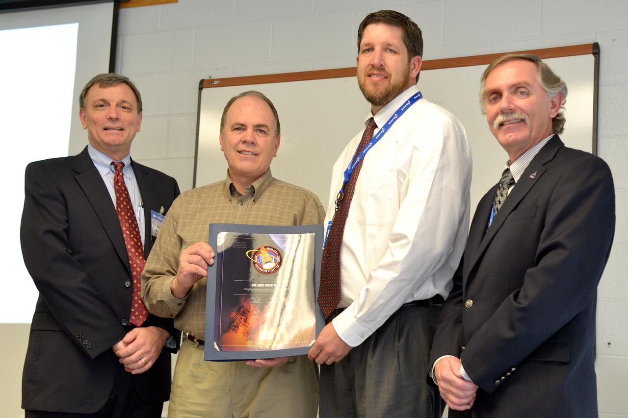 The Orion team congratulates the Orbital ATK team in Promontory, Utah on their efforts in making Exploration Flight Test-1 (EFT-1) a success on March 11, 2015. An award is presented to the ATK Abort Motor Team. Part of Batch image transfer from Flickr.