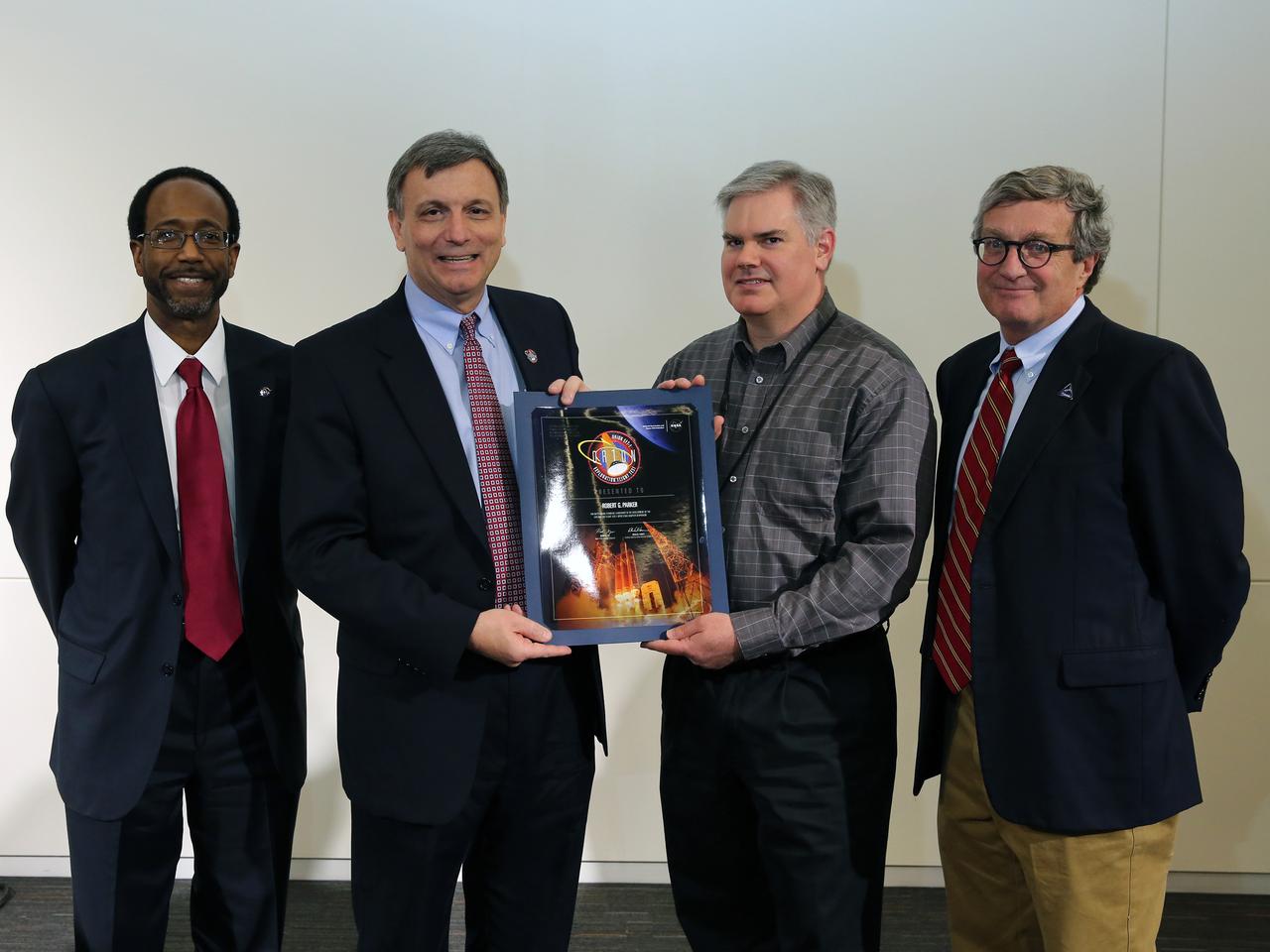 NASA and Lockheed Martin Orion leadership visit Langley Research Center in Hampton, VA on March 19, 2015 to celebrate the center's contribution to Orion's Exploration Flight Test-1 (EFT-1). Award was presented to Robert G. Parker. Part of Batch image transfer from Flickr.