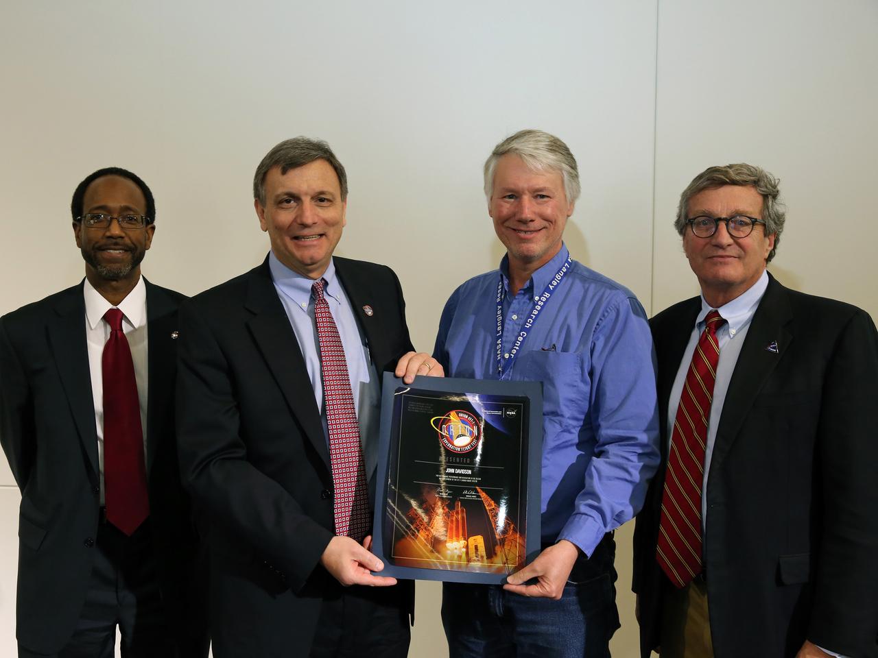 NASA and Lockheed Martin Orion leadership visit Langley Research Center in Hampton, VA on March 19, 2015 to celebrate the center's contribution to Orion's Exploration Flight Test-1 (EFT-1).  Award presented to John Davidson. Part of Batch image transfer from Flickr.