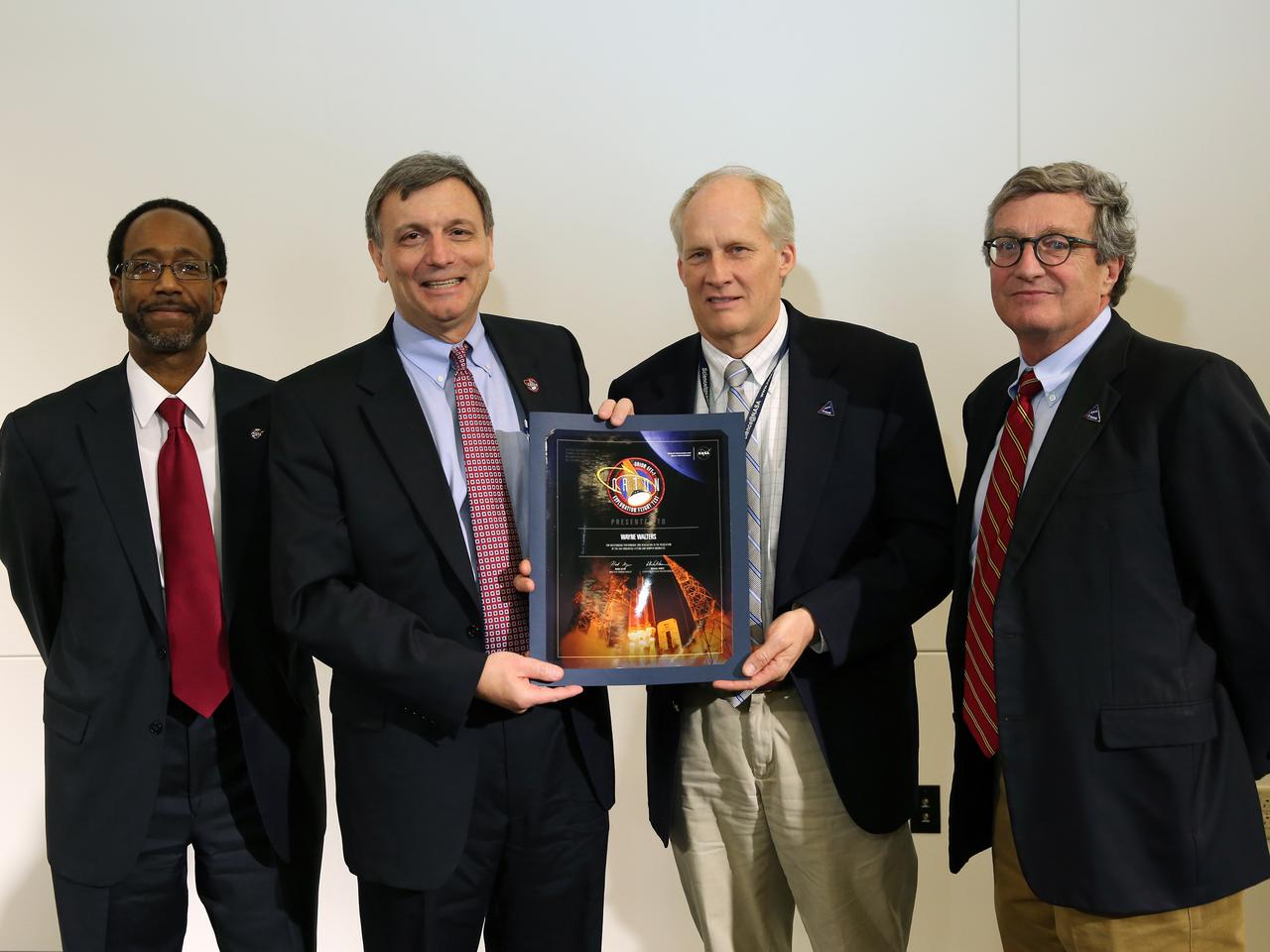 NASA and Lockheed Martin Orion leadership visit Langley Research Center in Hampton, VA on March 19, 2015 to celebrate the center's contribution to Orion's Exploration Flight Test-1 (EFT-1). Award presented to Wayne Walters. Part of Batch image transfer from Flickr.