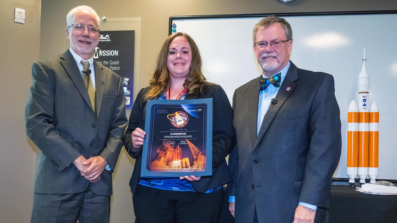 The Orion team visits United Launch Alliance in Denver, Colorado on July 14, 2015 to recognize their efforts in making Exploration Flight Test-1 (EFT-1) a success. Orion program manager, Mark Geyer, presents award to ULA Integration Team. Part of Batch image transfer from Flickr.