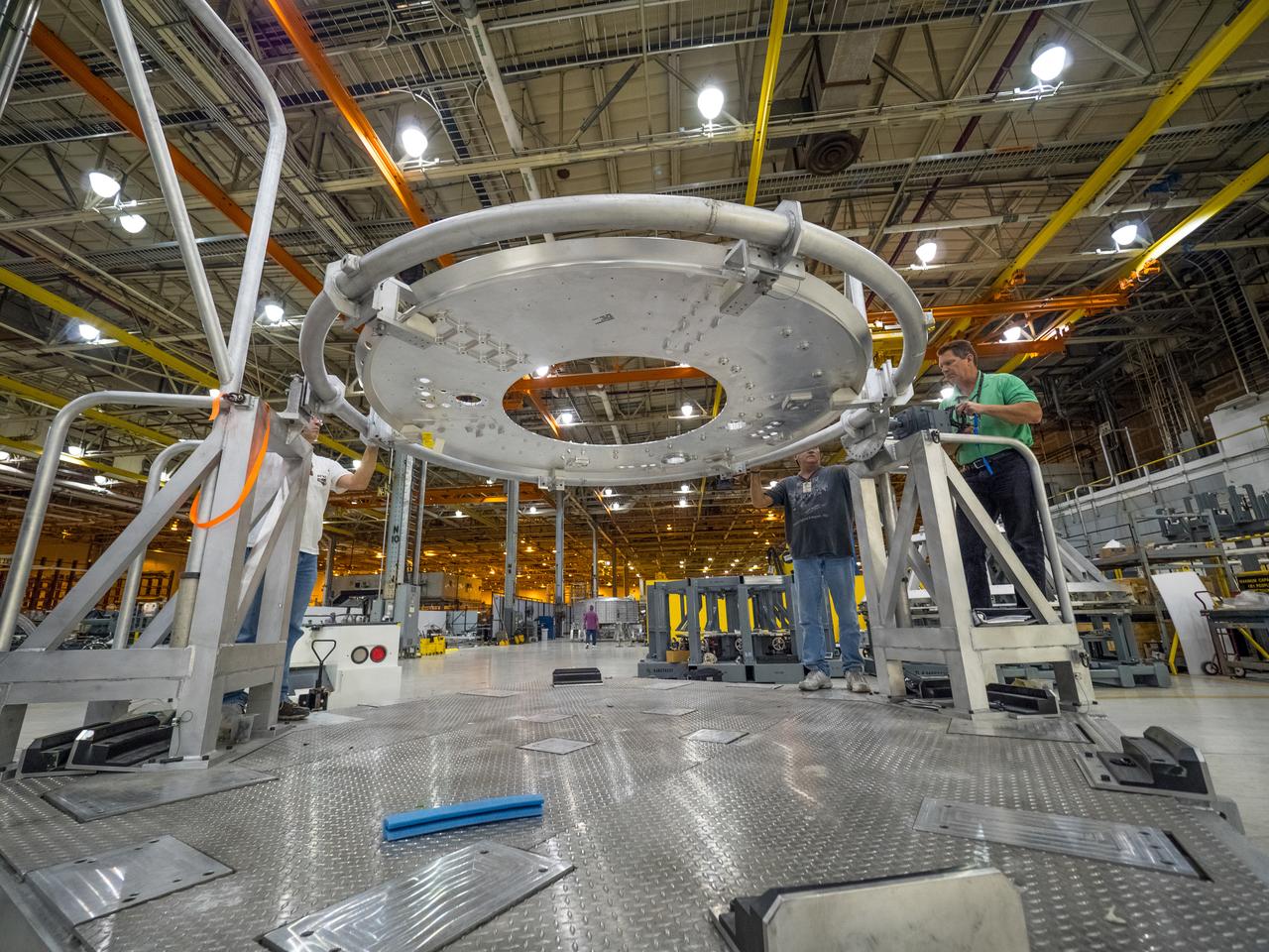 Pieces for the Orion spacecraft that will fly on Artemis I are prepared for welding at NASA's Michoud Assembly Facility in New Orleans, Louisiana on Aug. 6, 2015. Part of Batch image transfer from Flickr.