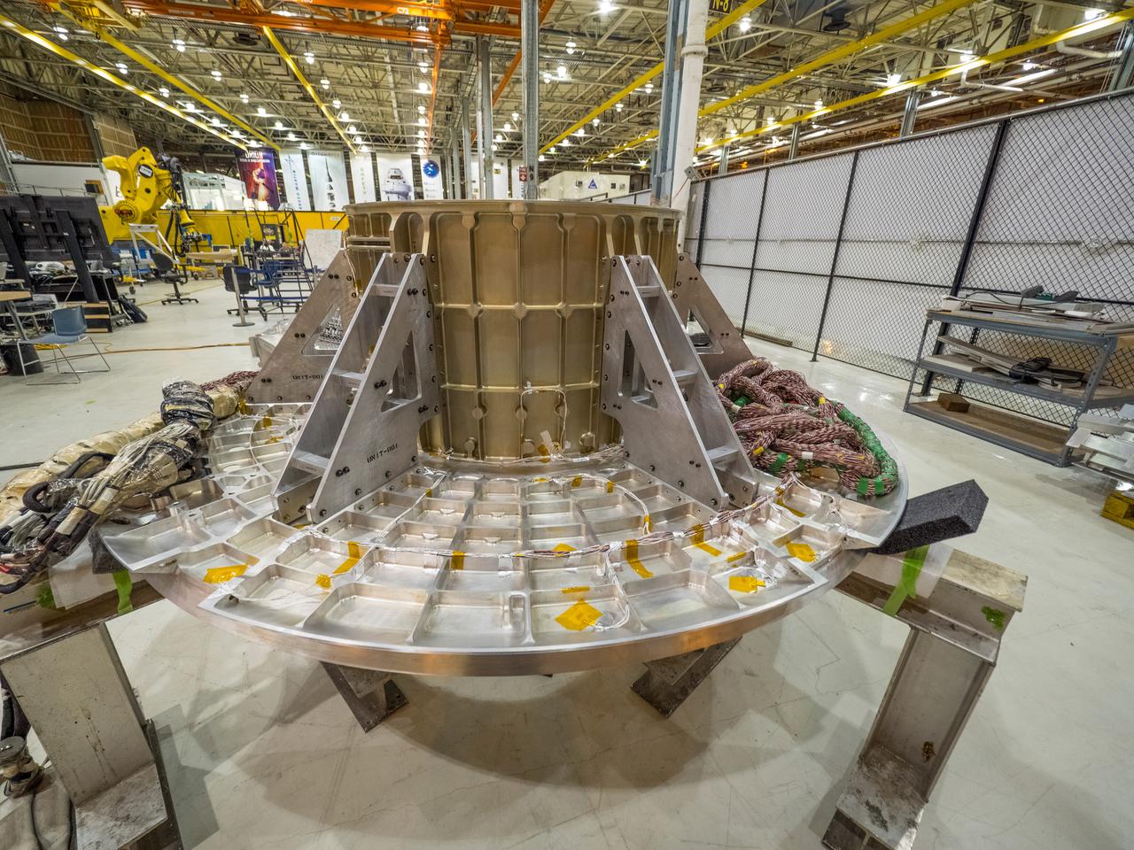 Pieces for the Orion spacecraft that will fly on Artemis I are prepared for welding at NASA's Michoud Assembly Facility in New Orleans, Louisiana on Aug. 6, 2015. Part of Batch image transfer from Flickr.