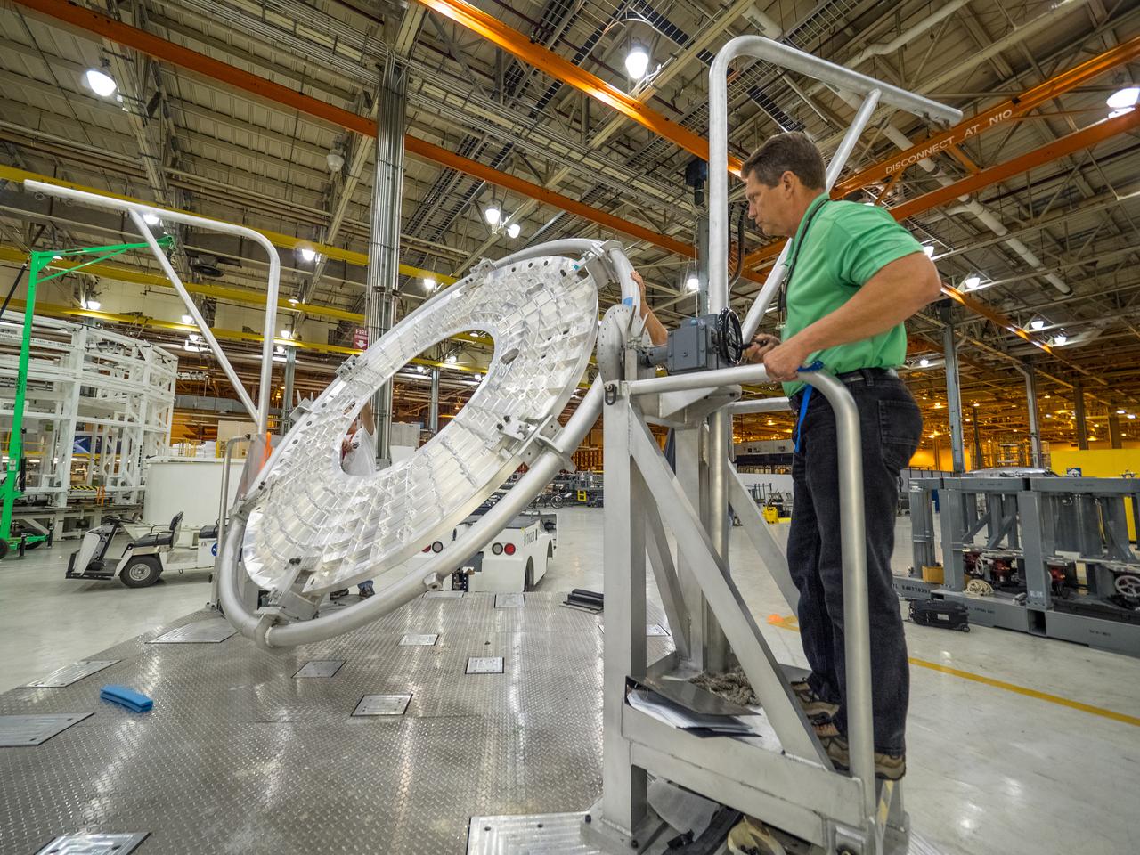 Pieces for the Orion spacecraft that will fly on Artemis I are prepared for welding at NASA's Michoud Assembly Facility in New Orleans, Louisiana on Aug. 6, 2015.  Part of Batch image transfer from Flickr.