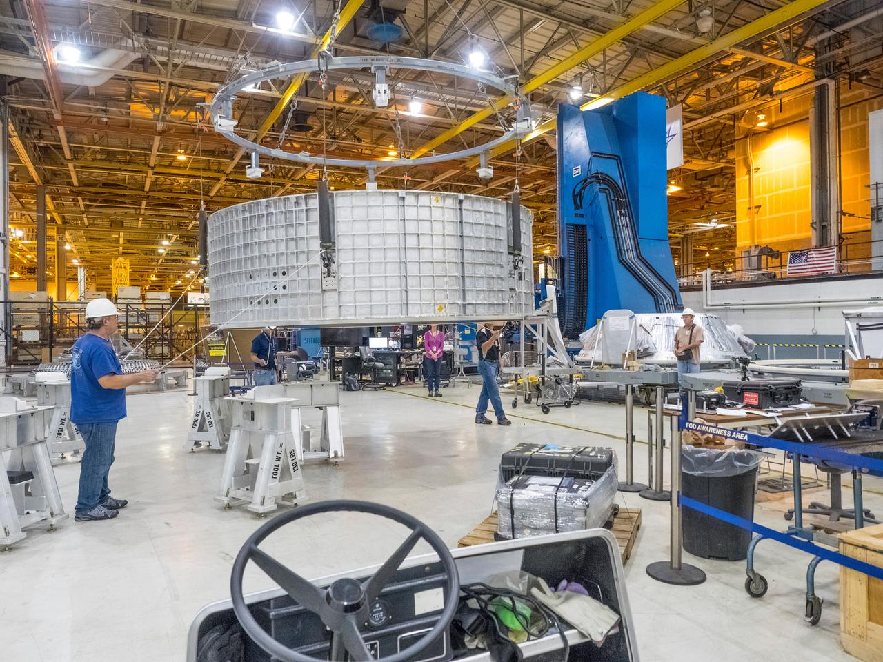 Pieces for the Orion spacecraft that will fly on Artemis I are prepared for welding at NASA's Michoud Assembly Facility in New Orleans, Louisiana on Aug. 7, 2015. Part of Batch image transfer from Flickr.