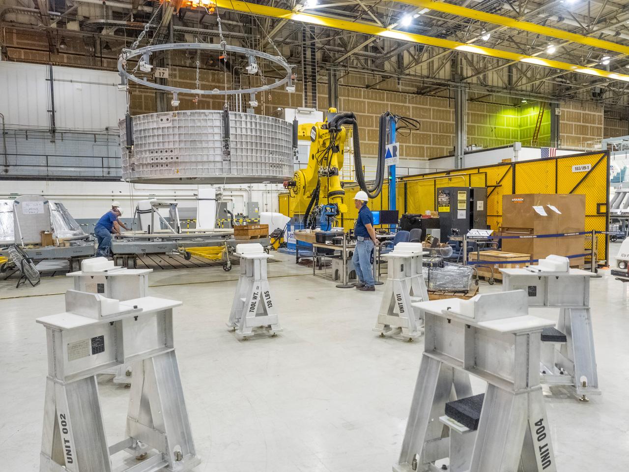 Pieces for the Orion spacecraft that will fly on Artemis I are prepared for welding at NASA's Michoud Assembly Facility in New Orleans, Louisiana on Aug. 7, 2015. Part of Batch image transfer from Flickr.