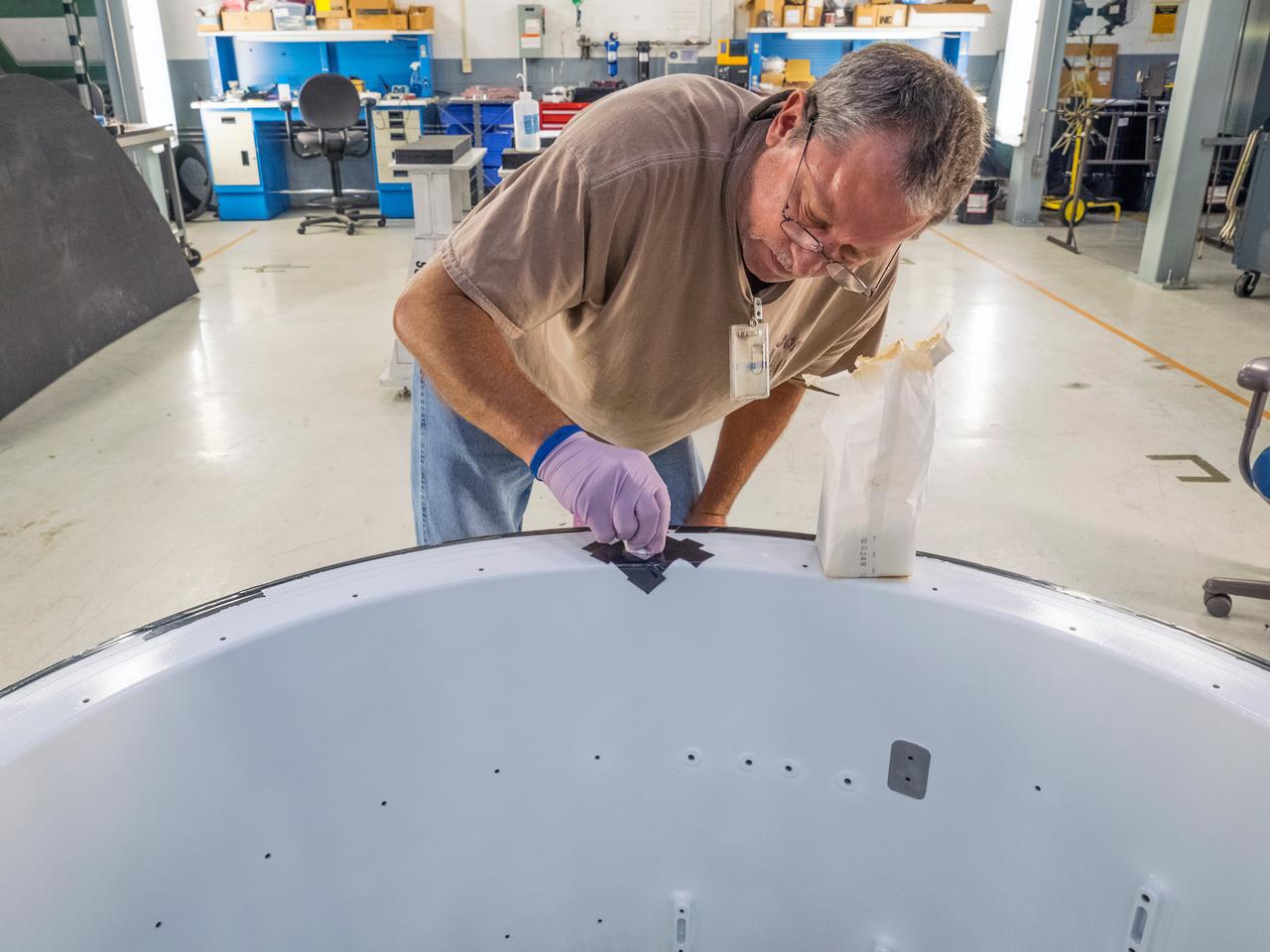 Pieces for the Orion spacecraft that will fly on Artemis I are prepared for welding at NASA's Michoud Assembly Facility in New Orleans, Louisiana on Aug. 7, 2015. Part of Batch image transfer from Flickr.