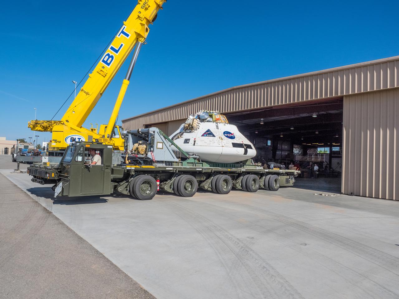 Engineers prepare to test the parachute system for NASA’s Orion spacecraft at the U.S. Army Yuma Proving Ground in Yuma, Arizona on Aug. 24, 2015. During the test, planned for Wednesday, Aug. 26, a C-17 aircraft will carry a representative Orion capsule to 35,000 feet in altitude and then drop it from its cargo bay. Engineers will test a scenario in which one of Orion’s two drogue parachutes, used to stabilize it in the air, does not deploy, and one of its three main parachutes, used to slow the capsule during the final stage of descent, also does not deploy. The risky test will provide data engineers will use as they gear up to qualify Orion’s parachutes for missions with astronauts. On Aug. 24, a C-17 was loaded with the test version of Orion, which has a similar mass and interfaces with the parachutes as the Orion being developed for deep space missions but is shorter on top to fit inside the aircraft. Part of Batch image transfer from Flickr.