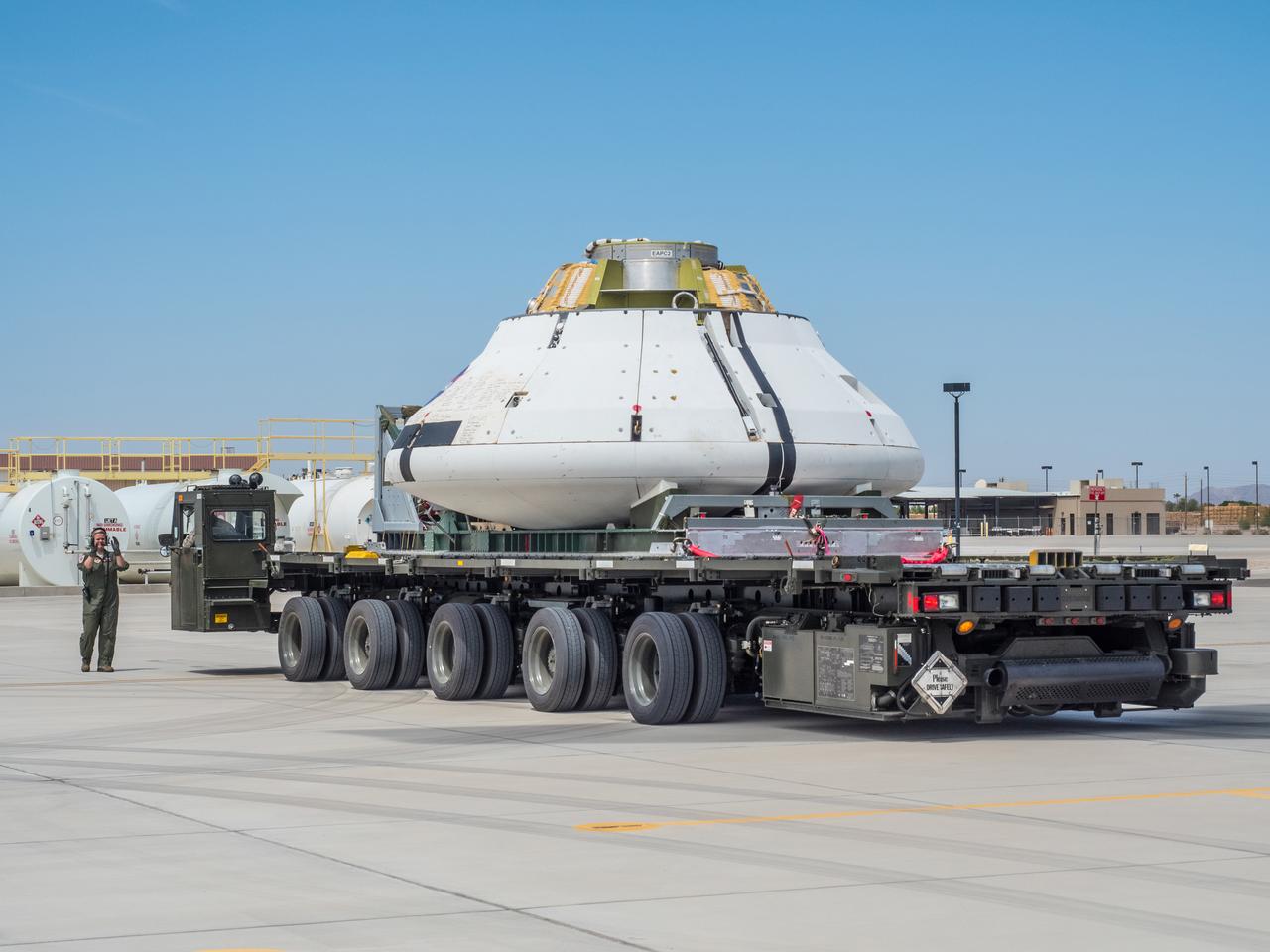 Engineers prepare to test the parachute system for NASA’s Orion spacecraft at the U.S. Army Yuma Proving Ground in Yuma, Arizona on Aug. 24, 2015. During the test, planned for Wednesday, Aug. 26, a C-17 aircraft will carry a representative Orion capsule to 35,000 feet in altitude and then drop it from its cargo bay. Engineers will test a scenario in which one of Orion’s two drogue parachutes, used to stabilize it in the air, does not deploy, and one of its three main parachutes, used to slow the capsule during the final stage of descent, also does not deploy. The risky test will provide data engineers will use as they gear up to qualify Orion’s parachutes for missions with astronauts. On Aug. 24, a C-17 was loaded with the test version of Orion, which has a similar mass and interfaces with the parachutes as the Orion being developed for deep space missions but is shorter on top to fit inside the aircraft. Part of Batch image transfer from Flickr.