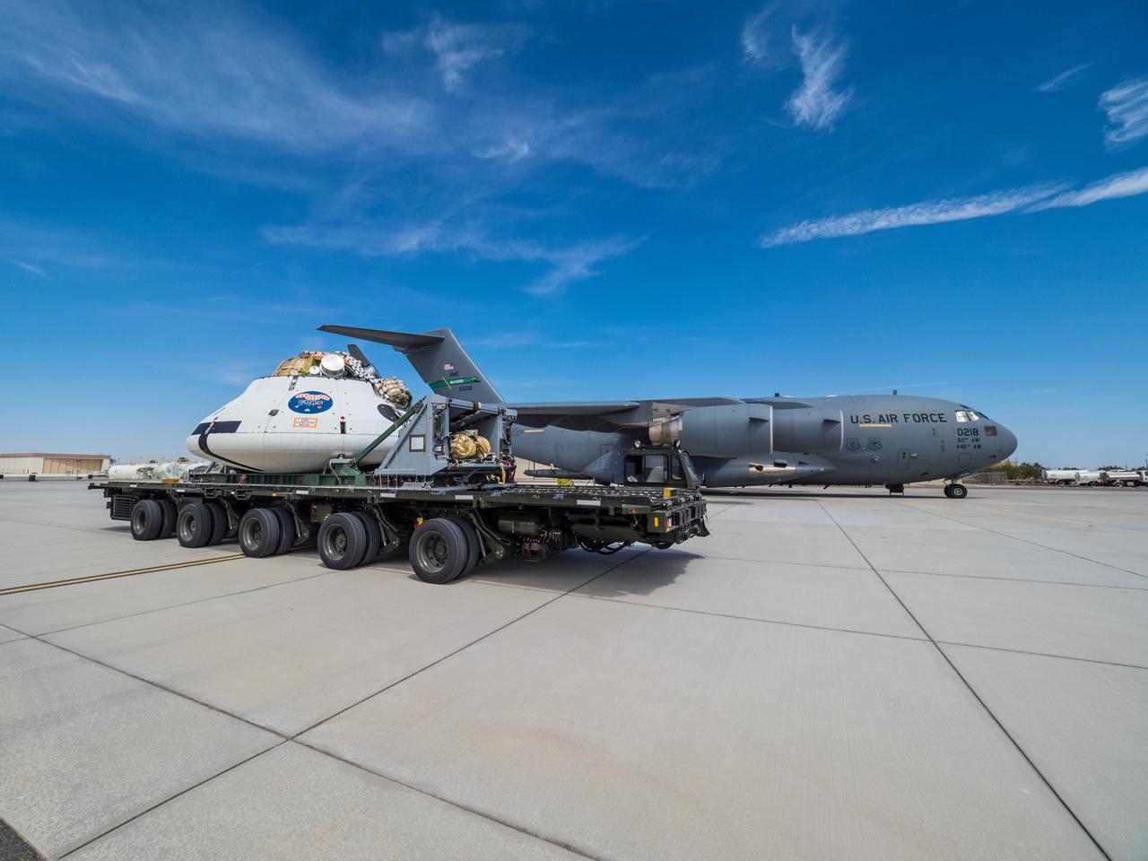 Engineers prepare to test the parachute system for NASA’s Orion spacecraft at the U.S. Army Yuma Proving Ground in Yuma, Arizona on Aug. 24, 2015. During the test, planned for Wednesday, Aug. 26, a C-17 aircraft will carry a representative Orion capsule to 35,000 feet in altitude and then drop it from its cargo bay. Engineers will test a scenario in which one of Orion’s two drogue parachutes, used to stabilize it in the air, does not deploy, and one of its three main parachutes, used to slow the capsule during the final stage of descent, also does not deploy. The risky test will provide data engineers will use as they gear up to qualify Orion’s parachutes for missions with astronauts. On Aug. 24, a C-17 was loaded with the test version of Orion, which has a similar mass and interfaces with the parachutes as the Orion being developed for deep space missions but is shorter on top to fit inside the aircraft. Part of Batch image transfer from Flickr.