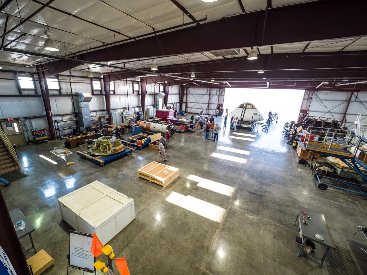 Engineers prepare to test the parachute system for NASA’s Orion spacecraft at the U.S. Army Yuma Proving Ground in Yuma, Arizona on Aug. 24, 2015. During the test, planned for Wednesday, Aug. 26, a C-17 aircraft will carry a representative Orion capsule to 35,000 feet in altitude and then drop it from its cargo bay. Engineers will test a scenario in which one of Orion’s two drogue parachutes, used to stabilize it in the air, does not deploy, and one of its three main parachutes, used to slow the capsule during the final stage of descent, also does not deploy. The risky test will provide data engineers will use as they gear up to qualify Orion’s parachutes for missions with astronauts. On Aug. 24, a C-17 was loaded with the test version of Orion, which has a similar mass and interfaces with the parachutes as the Orion being developed for deep space missions but is shorter on top to fit inside the aircraft. Part of Batch image transfer from Flickr.
