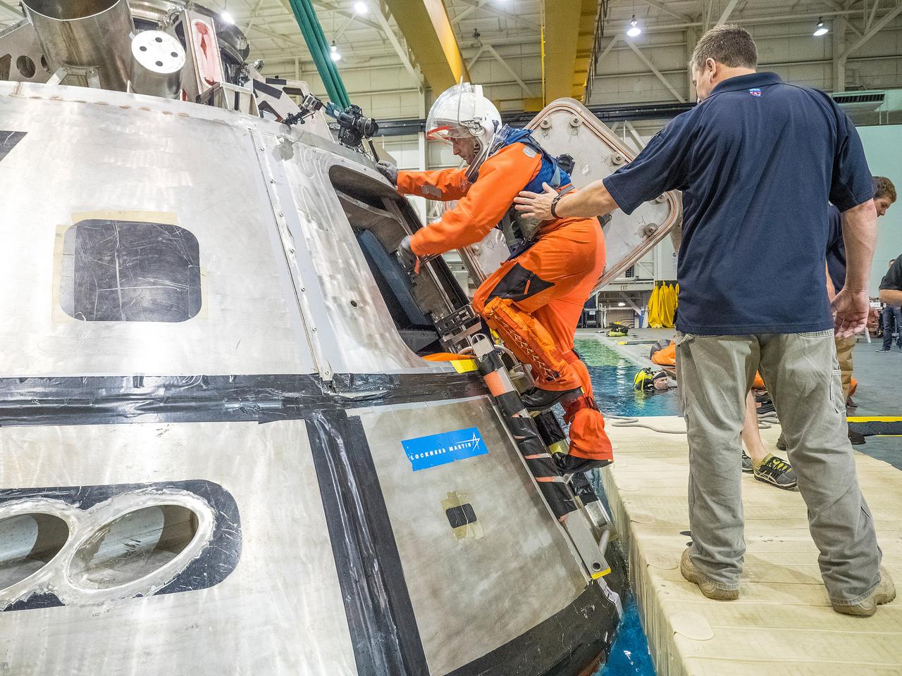Teams perform a series of tests at NASA’s Neutral Buoyancy Laboratory (NBL) at the agency’s Johnson Space Center in Houston on Oct. 7, 2015, to evaluate the most efficient way for astronauts to get out of the Orion spacecraft after weeks or months away from Earth. Part of Batch image transfer from Flickr.