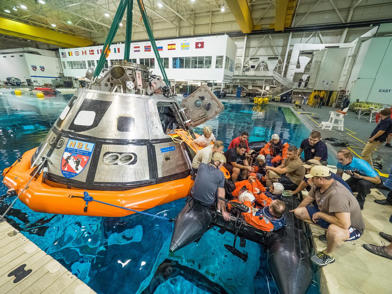 Teams perform a series of tests at NASA’s Neutral Buoyancy Laboratory (NBL) at the agency’s Johnson Space Center in Houston on Oct. 7, 2015, to evaluate the most efficient way for astronauts to get out of the Orion spacecraft after weeks or months away from Earth. Part of Batch image transfer from Flickr.