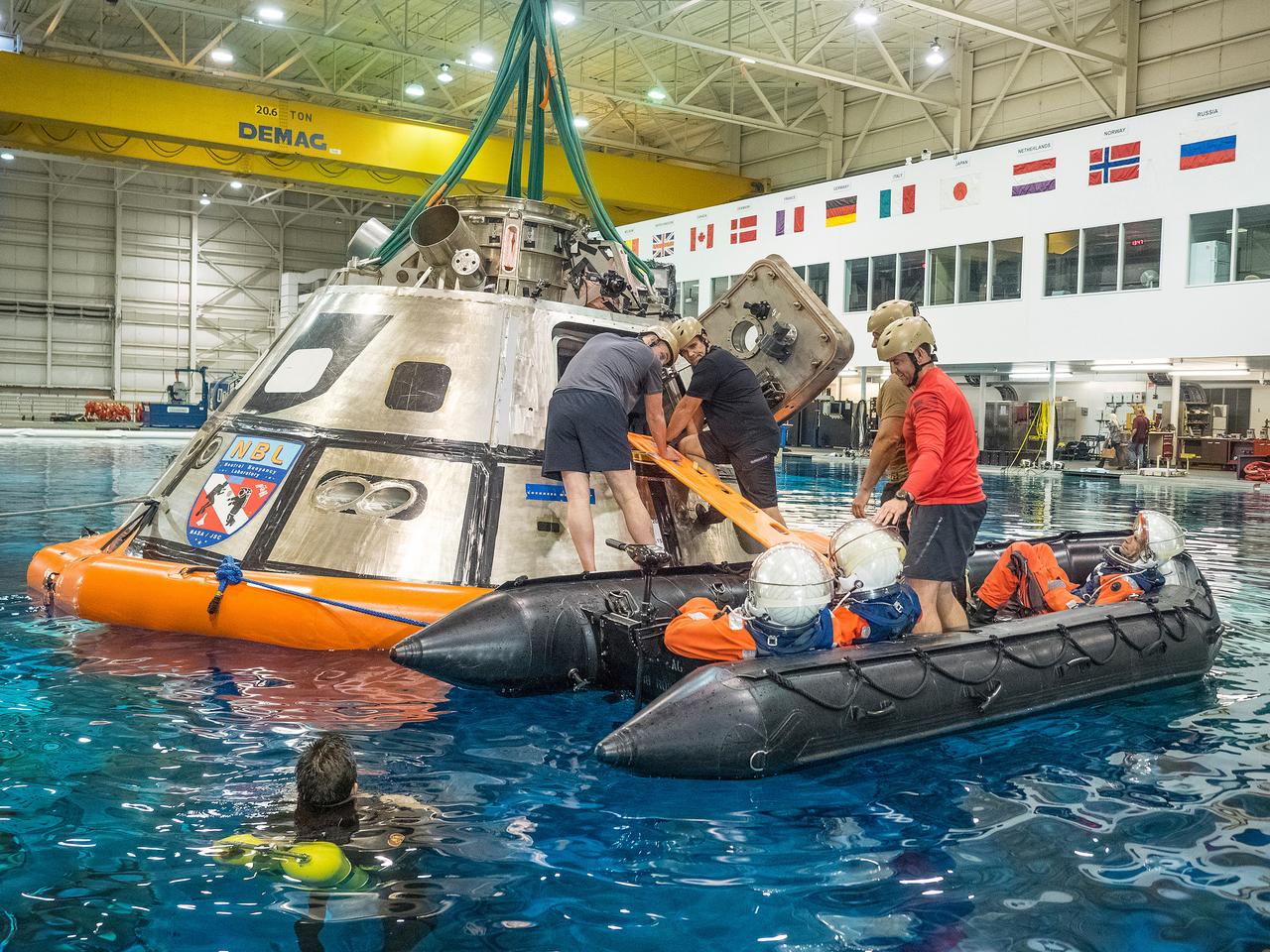 Teams perform a series of tests at NASA’s Neutral Buoyancy Laboratory (NBL) at the agency’s Johnson Space Center in Houston on Oct. 7, 2015, to evaluate the most efficient way for astronauts to get out of the Orion spacecraft after weeks or months away from Earth. Part of Batch image transfer from Flickr.