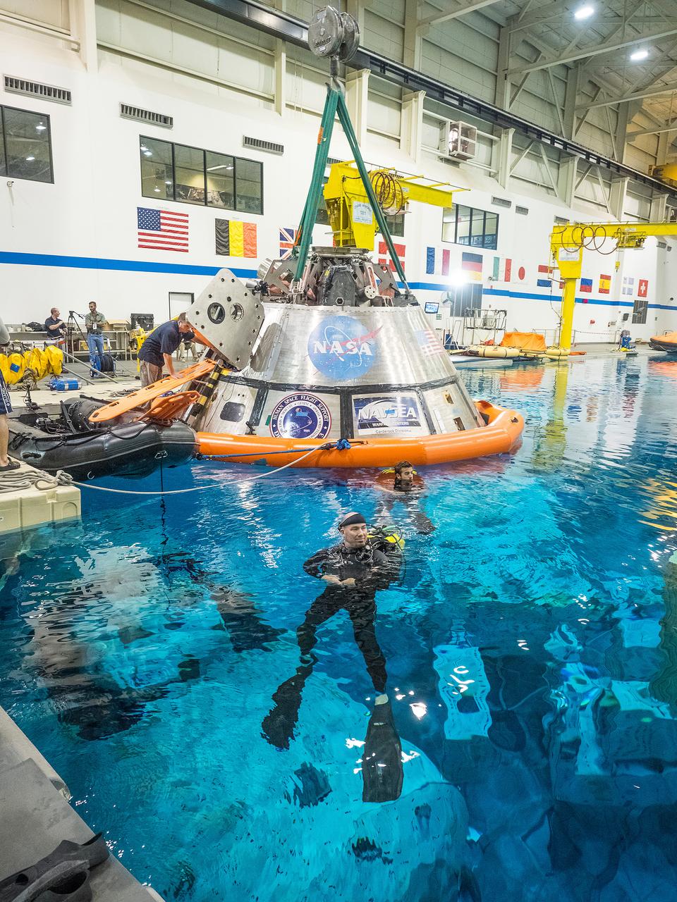 Teams perform a series of tests at NASA’s Neutral Buoyancy Laboratory (NBL) at the agency’s Johnson Space Center in Houston on Oct. 7, 2015, to evaluate the most efficient way for astronauts to get out of the Orion spacecraft after weeks or months away from Earth. Part of Batch image transfer from Flickr.