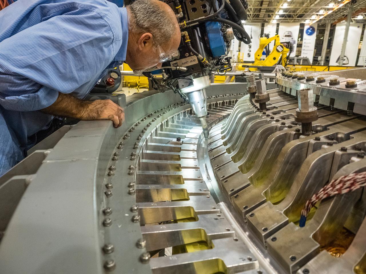 The Artemis I Orion aft bulkhead is welded to the barrel of the Orion pressure vessel at the Michoud Assembly Facility in New Orleans, Louisiana on Oct. 12, 2015. Part of Batch image transfer from Flickr.