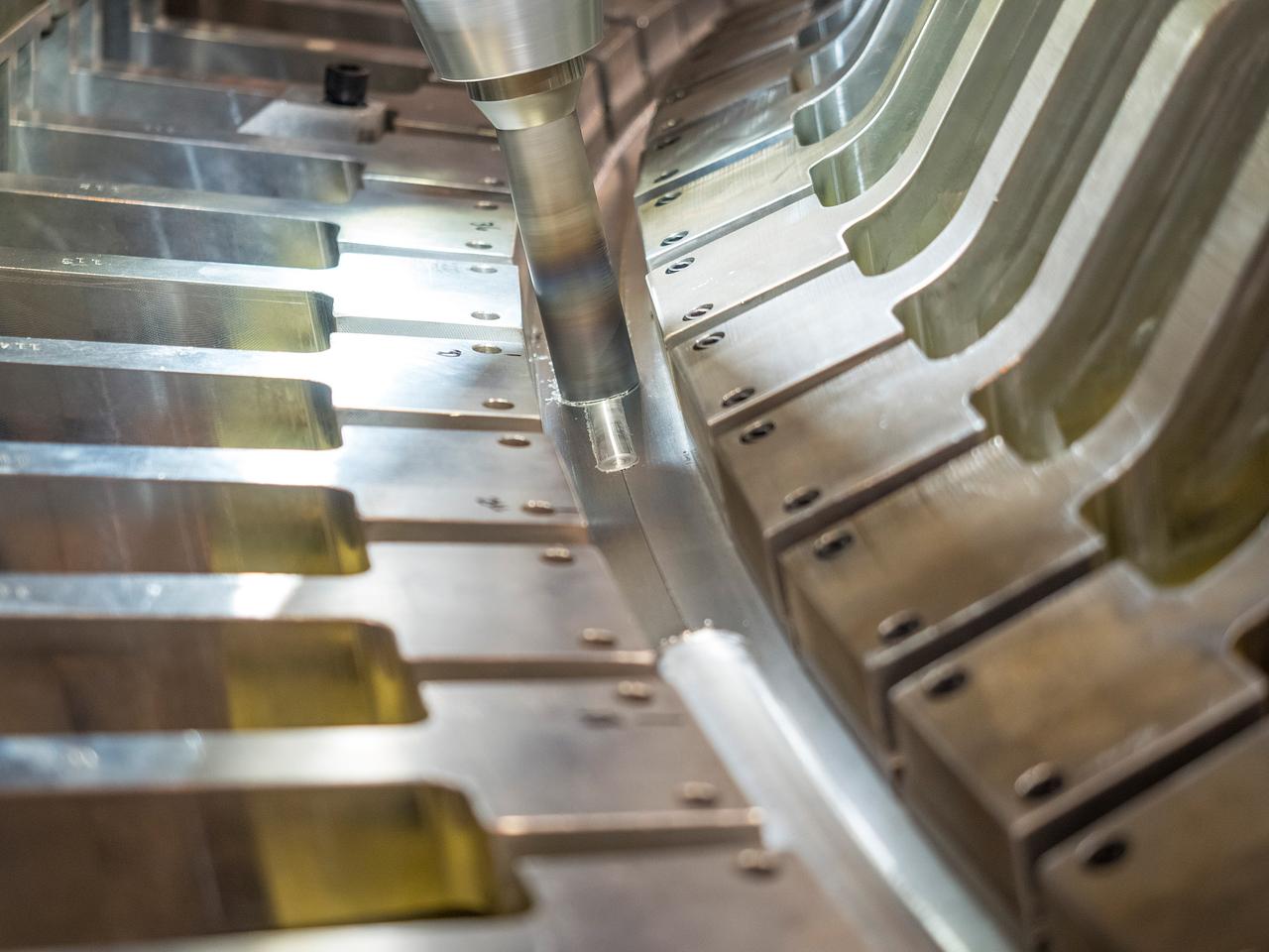 The Artemis I Orion aft bulkhead is welded to the barrel of the Orion pressure vessel at the Michoud Assembly Facility in New Orleans, Louisiana on Oct. 12, 2015. Part of Batch image transfer from Flickr.