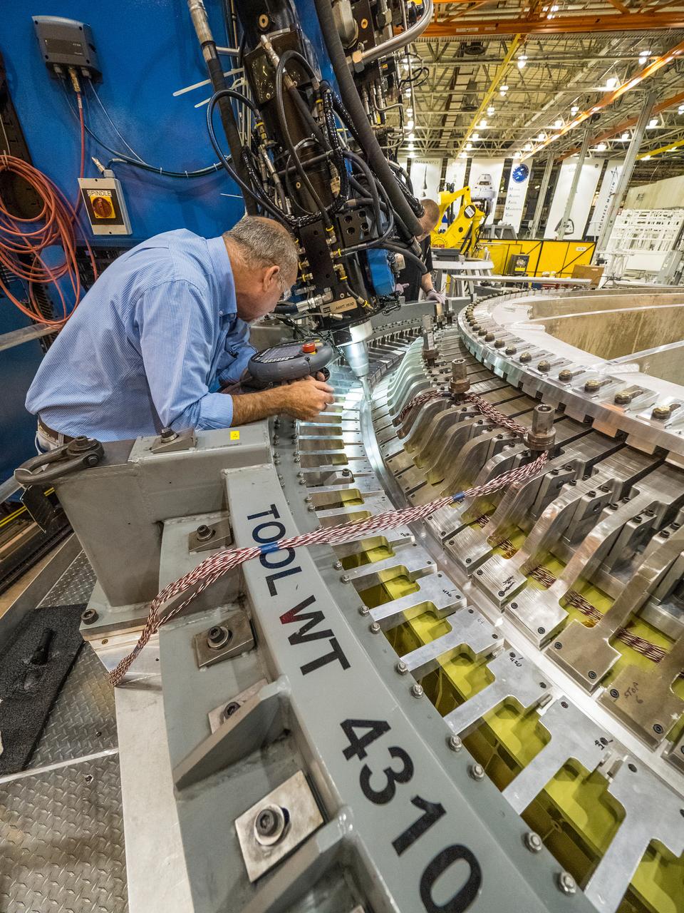 The Artemis I Orion aft bulkhead is welded to the barrel of the Orion pressure vessel at the Michoud Assembly Facility in New Orleans, Louisiana on Oct. 12, 2015. Part of Batch image transfer from Flickr.