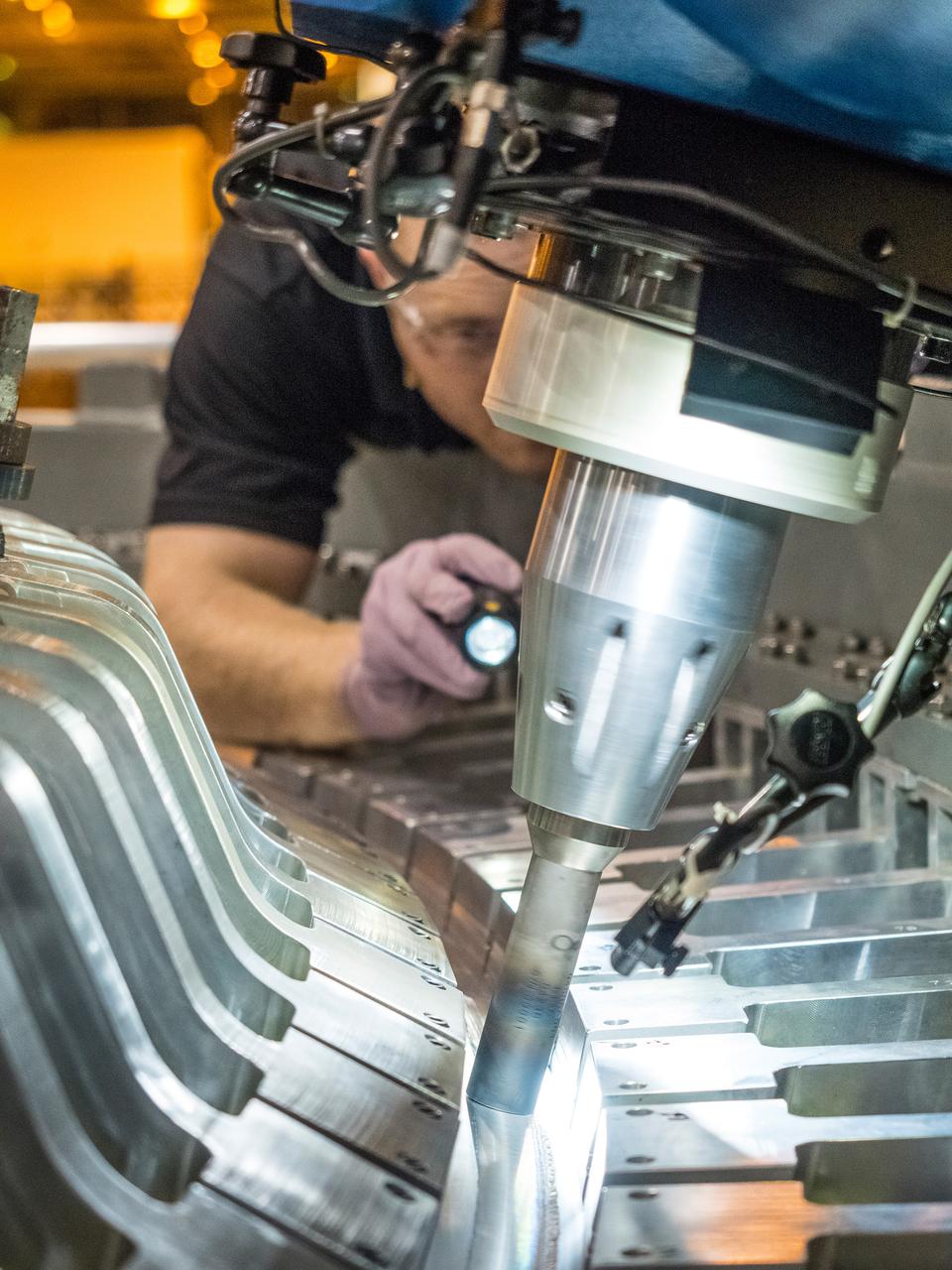 The Artemis I Orion aft bulkhead is welded to the barrel of the Orion pressure vessel at the Michoud Assembly Facility in New Orleans, Louisiana on Oct. 12, 2015. Part of Batch image transfer from Flickr.