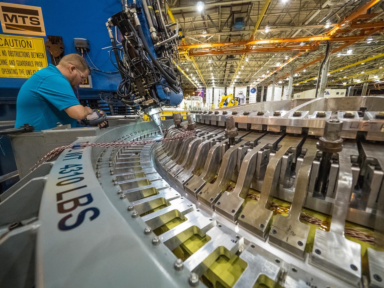 The Artemis I Orion aft bulkhead is welded to the barrel of the Orion pressure vessel at the Michoud Assembly Facility in New Orleans, Louisiana on Oct. 12, 2015. Part of Batch image transfer from Flickr.