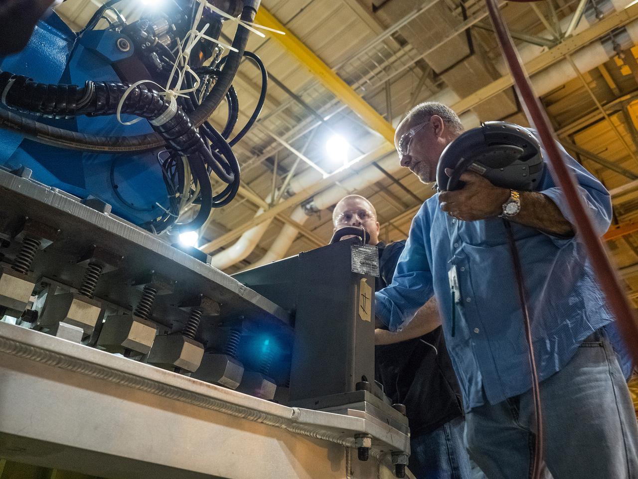 The Artemis I Orion aft bulkhead is welded to the barrel of the Orion pressure vessel at the Michoud Assembly Facility in New Orleans, Louisiana on Oct. 12, 2015. Part of Batch image transfer from Flickr.