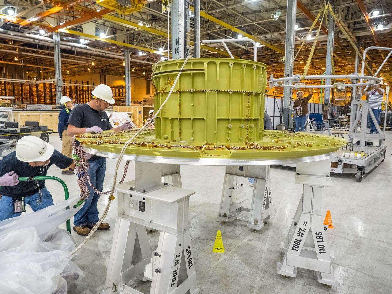 The first welded part of Artemis I Orion, the forward bulkhead and tunnel, is moved into final tooling at the Michoud Assembly Facility in New Orleans, Louisiana on Oct. 12, 2015. Part of Batch image transfer from Flickr.