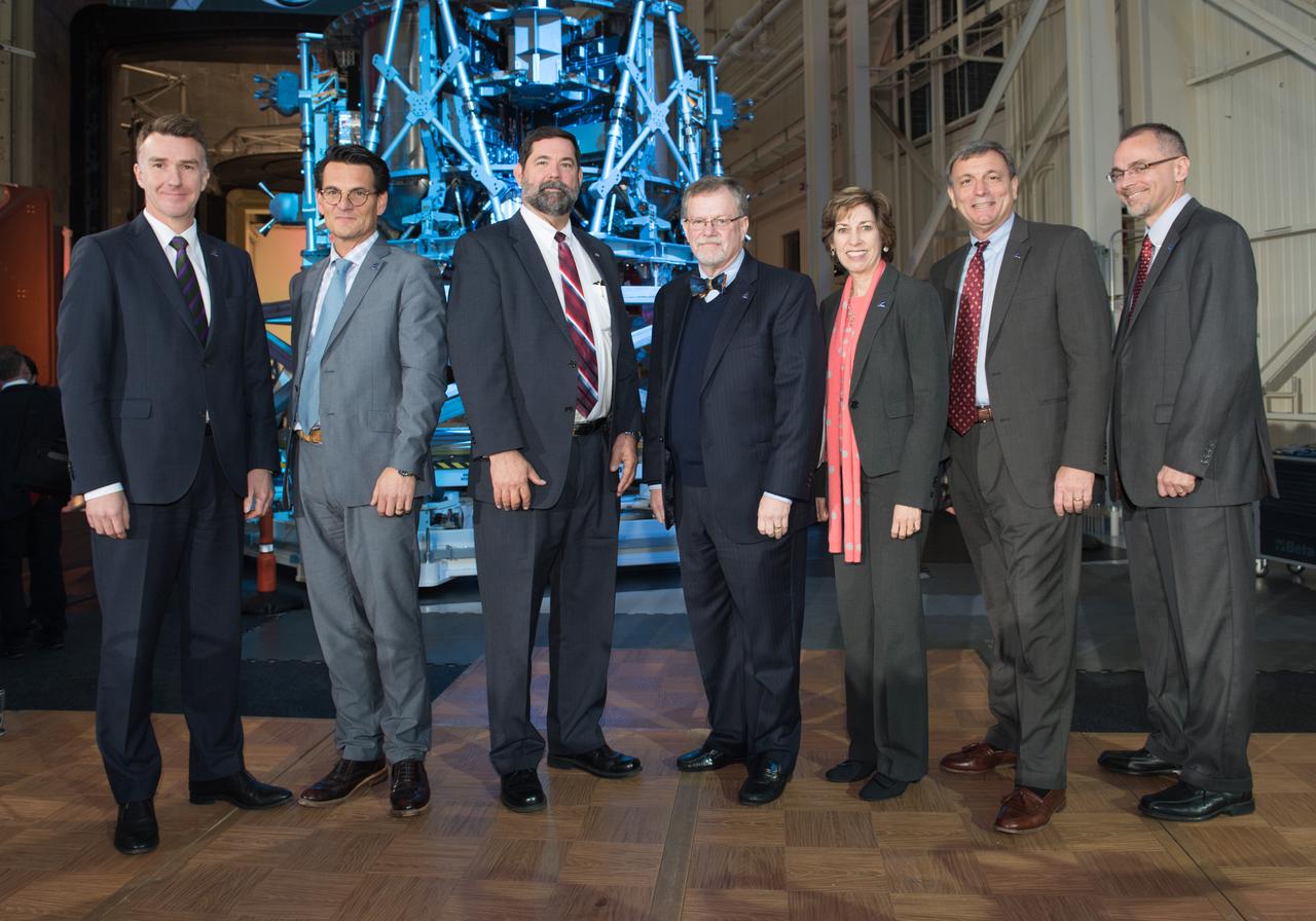 The European Service Module Structural Test Article (in the background) photographed at the Space Power Facility at NASA Glenn Research Center's Plum Brook Station in Sandusky, Ohio on Nov. 30, 2015. Group photo (including JSC Director Ellen Ochoa) taken in front of structure. Part of Batch image transfer from Flickr.