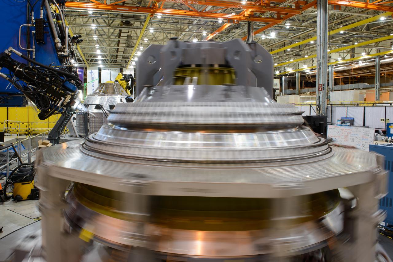 Technicians at NASA's Michoud Assembly Facility in New Orleans work on the cone weld for the Artemis I Orion crew module pressure vessel on Dec. 9, 2015.  Part of Batch image transfer from Flickr.