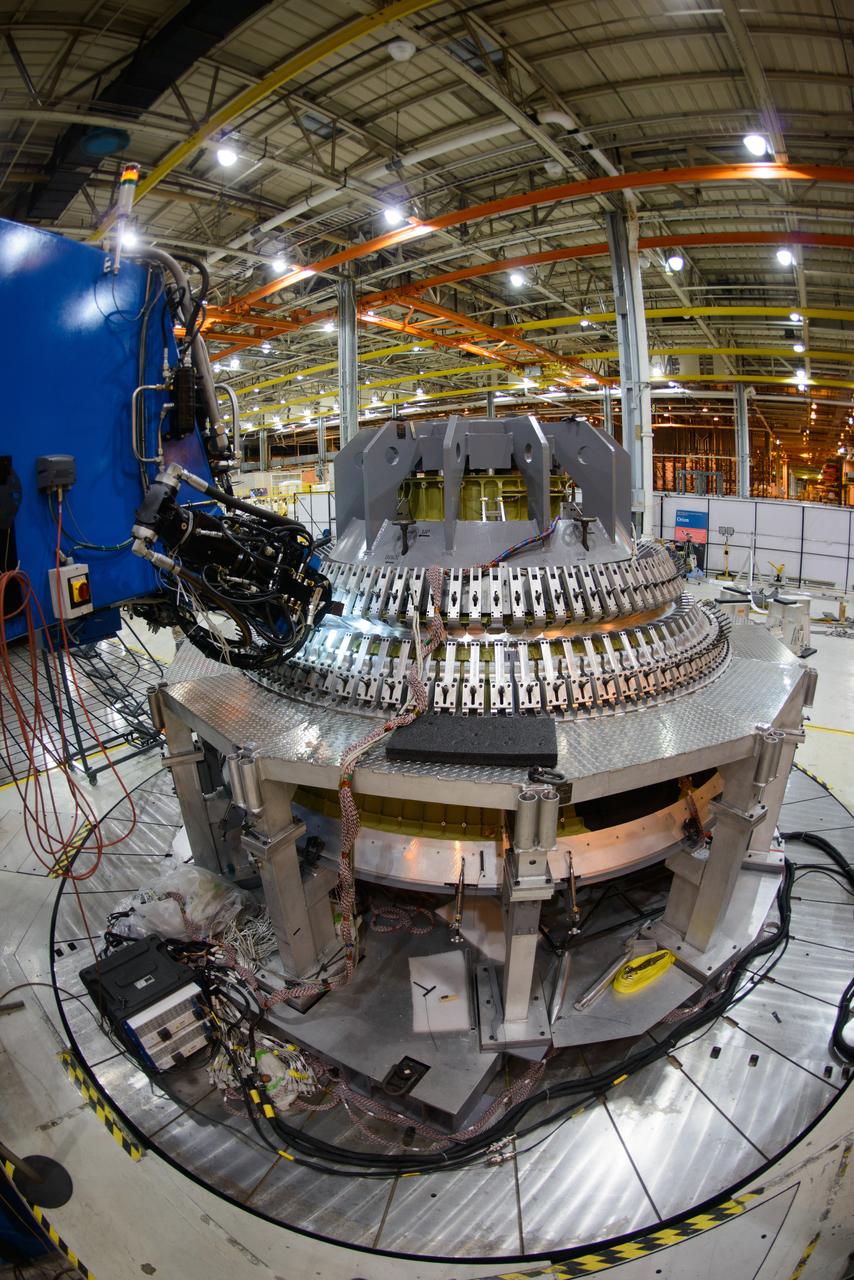 Technicians at NASA's Michoud Assembly Facility in New Orleans work on the cone weld for the Artemis I Orion crew module pressure vessel on Dec. 9, 2015.  Part of Batch image transfer from Flickr.