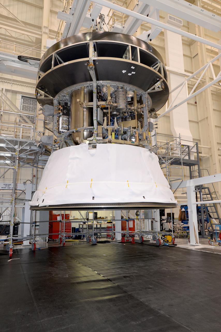 The European Service Module structural test model, shown on Jan. 23, 2016, is used for testing purposes before installing the real thing. It is as close to the flight version as possible while keeping costs and development time manageable. The structure and weight are the same, while mass equivalents stand in for electronics boxes not needed for the series of tests...The model was installed under a test version of the Crew Module Adapter, and sits on the Spacecraft Adapter that will attach Orion to its launch vehicle. This is the first time the European hardware has been physically connected to NASA’s elements...The service module will be shaken at NASA’s Plum Brook station in Sandusky, Ohio, USA, to recreate the vibrations of launch, as well as being subjected to acoustic and shock environments. Part of Batch image transfer from Flickr.