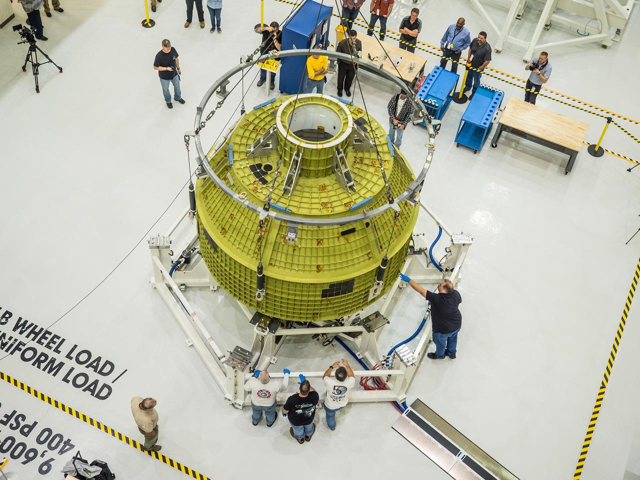After arriving from New Orleans by Super Guppy, Artemis I Orion is moved to the work stand at the Operations and Checkout Building at NASA's Kennedy Space Center on Feb. 2, 2016. Part of Batch image transfer from Flickr.
