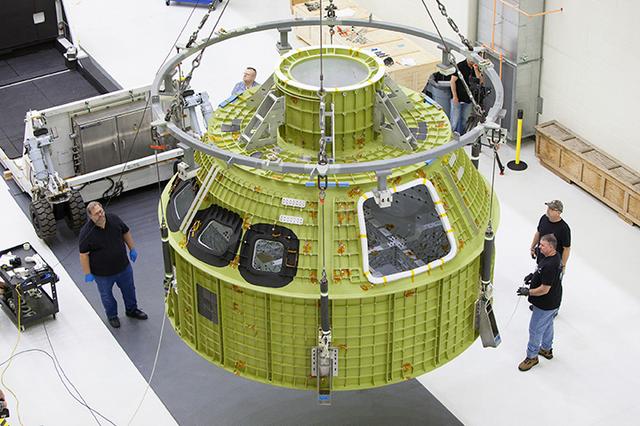 The Artemis I Orion pressure vessel sits fully unwrapped, lifted and moved to the birdcage inside the Operations and Checkout Building high bay at Kennedy Space Center on Feb. 2, 2016. Part of Batch image transfer from Flickr.