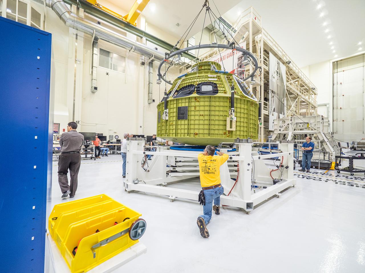 After arriving from New Orleans by Super Guppy, Artemis I Orion is moved to the work stand at the Operations and Checkout Building at NASA's Kennedy Space Center on Feb. 2, 2016.  Part of Batch image transfer from Flickr.