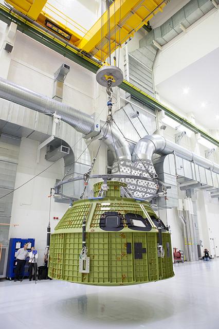 The Artemis I Orion pressure vessel sits fully unwrapped, lifted and moved to the birdcage inside the Operations and Checkout Building high bay at Kennedy Space Center on Feb. 2, 2016. Part of Batch image transfer from Flickr.