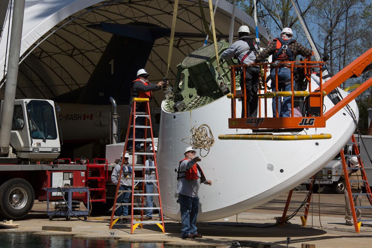 On April 6, 2016, engineers at NASA’s Langley Research Center in Hampton, Virginia, kicked off a series of nine drop tests of a representative Orion crew capsule with crash test dummies inside to understand what the spacecraft and astronauts may experience when landing in the Pacific Ocean after deep-space missions. The high-fidelity capsule, coupled with the heat shield from Orion's first flight in space, was hoisted approximately 16 feet above the water and vertically dropped into Langley’s 20-foot-deep Hydro Impact Basin. The crash test dummies were instrumented to provide data and secured inside the capsule to help provide information engineers need to ensure astronauts will be protected from injury during splashdown. Each test in the series simulates different scenarios for Orion’s parachute-assisted landings, wind conditions, velocities and wave heights the spacecraft may experience when touching down in the ocean.