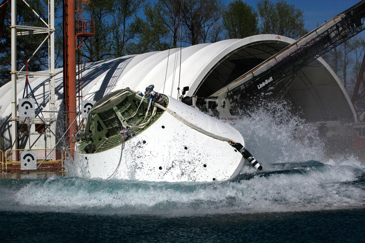 On April 6, 2016, engineers at NASA’s Langley Research Center in Hampton, Virginia, kicked off a series of nine drop tests of a representative Orion crew capsule with crash test dummies inside to understand what the spacecraft and astronauts may experience when landing in the Pacific Ocean after deep-space missions. The high-fidelity capsule, coupled with the heat shield from Orion's first flight in space, was hoisted approximately 16 feet above the water and vertically dropped into Langley’s 20-foot-deep Hydro Impact Basin. The crash test dummies were instrumented to provide data and secured inside the capsule to help provide information engineers need to ensure astronauts will be protected from injury during splashdown. Each test in the series simulates different scenarios for Orion’s parachute-assisted landings, wind conditions, velocities and wave heights the spacecraft may experience when touching down in the ocean.