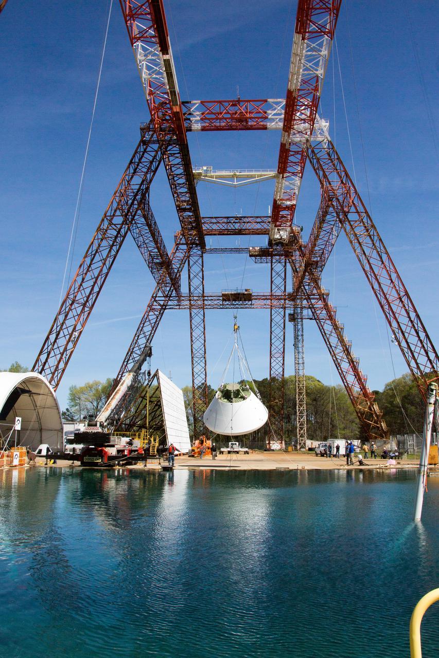 On April 6, 2016, engineers at NASA’s Langley Research Center in Hampton, Virginia, kicked off a series of nine drop tests of a representative Orion crew capsule with crash test dummies inside to understand what the spacecraft and astronauts may experience when landing in the Pacific Ocean after deep-space missions. The high-fidelity capsule, coupled with the heat shield from Orion's first flight in space, was hoisted approximately 16 feet above the water and vertically dropped into Langley’s 20-foot-deep Hydro Impact Basin. The crash test dummies were instrumented to provide data and secured inside the capsule to help provide information engineers need to ensure astronauts will be protected from injury during splashdown. Each test in the series simulates different scenarios for Orion’s parachute-assisted landings, wind conditions, velocities and wave heights the spacecraft may experience when touching down in the ocean.
