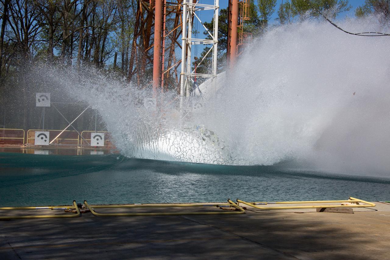 On April 6, 2016, engineers at NASA’s Langley Research Center in Hampton, Virginia, kicked off a series of nine drop tests of a representative Orion crew capsule with crash test dummies inside to understand what the spacecraft and astronauts may experience when landing in the Pacific Ocean after deep-space missions. The high-fidelity capsule, coupled with the heat shield from Orion's first flight in space, was hoisted approximately 16 feet above the water and vertically dropped into Langley’s 20-foot-deep Hydro Impact Basin. The crash test dummies were instrumented to provide data and secured inside the capsule to help provide information engineers need to ensure astronauts will be protected from injury during splashdown. Each test in the series simulates different scenarios for Orion’s parachute-assisted landings, wind conditions, velocities and wave heights the spacecraft may experience when touching down in the ocean.